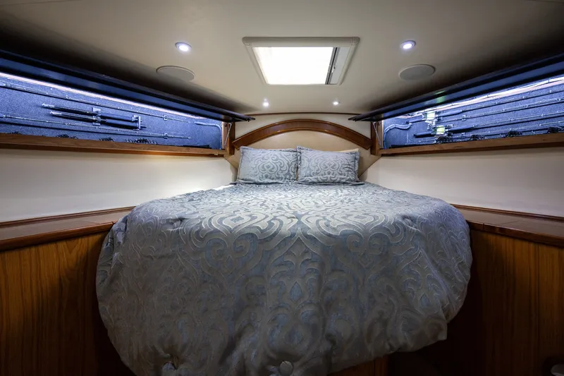 Slide: The Image of Luxurious 2008 B&D Convertible cabin with elegant bedding and ambient lighting. - 46