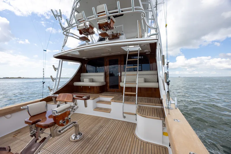 Slide: The Image of Luxury 2008 B&D Convertible yacht with wooden deck and seating, cruising on open water. - 15