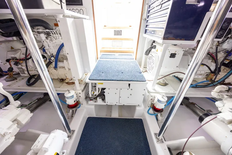 Slide: The Image of Engine room of a 2008 B&D Convertible boat with visible machinery and equipment. - 61
