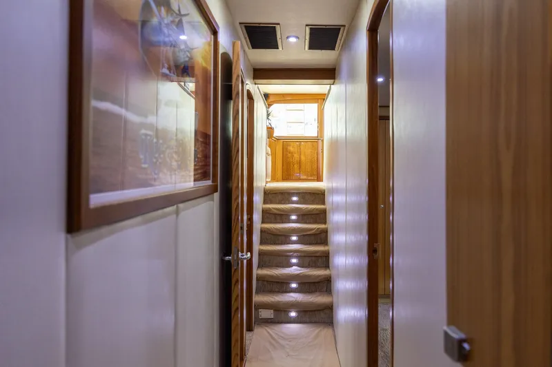 Slide: The Image of Interior hallway of a 2008 B&D Convertible yacht with illuminated stairs. - 49