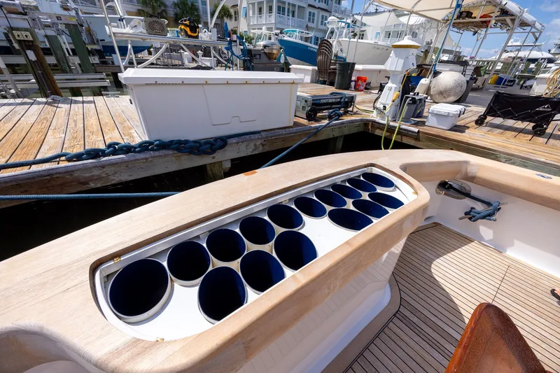 Slide: The Image of 2008 B&D Convertible boat with rod holders at a marina dock. - 24
