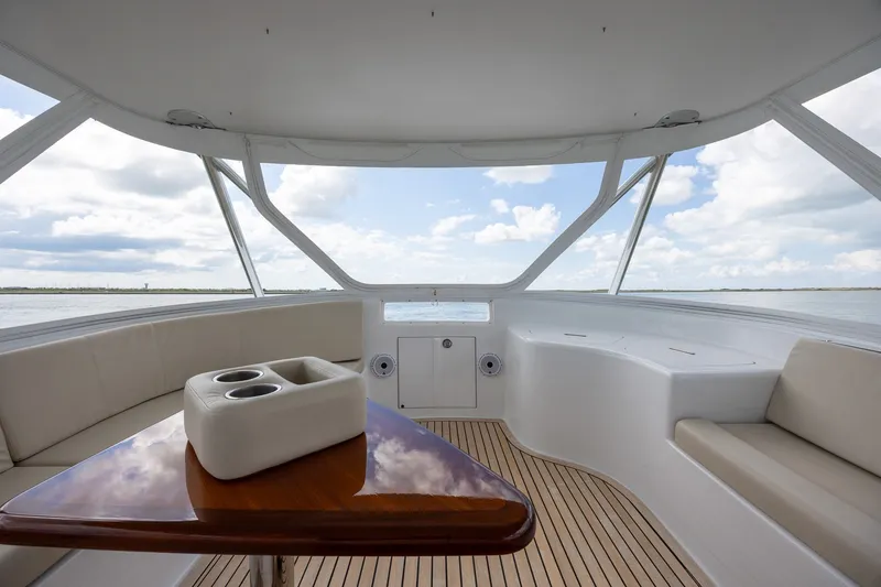 Slide: The Image of Luxurious 2008 B&D Convertible yacht interior with elegant seating and ocean view. - 52