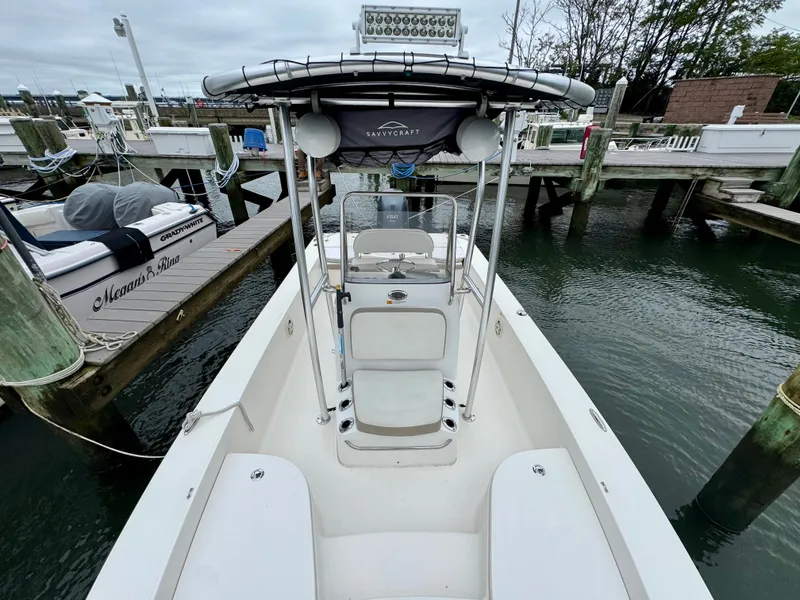 Slide: The Image of The image shows a 2015 Robalo 206 Cayman boat at a dock. - 7