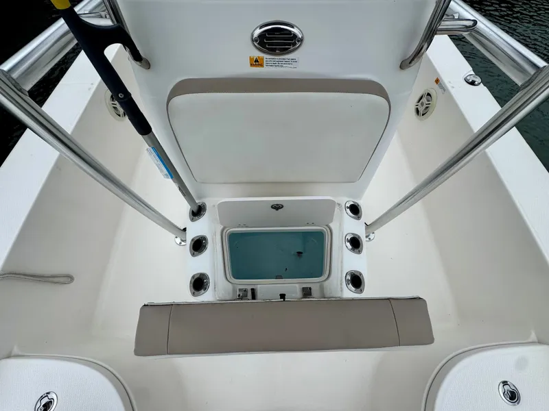 Slide: The Image of The image shows the cockpit of a 2015 Robalo 206 Cayman with a central storage area. - 13