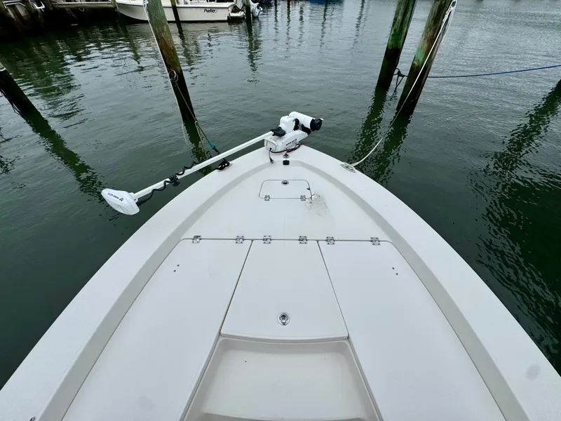 Slide: The Image of The image shows the bow of a 2015 Robalo 206 Cayman with a mounted trolling motor. - 15