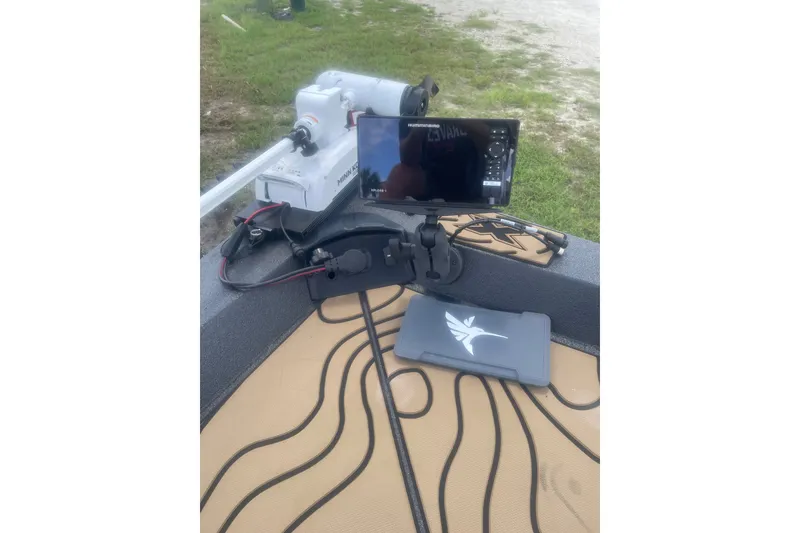 Slide: The Image of 2026 Xpress H22 boat dashboard with Humminbird fish finder and Minn Kota trolling motor. - 9