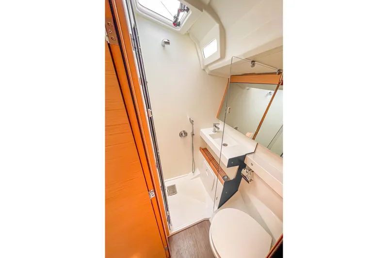 Slide: The Image of Modern bathroom in 2023 Jeanneau Sun Odyssey 440 yacht, featuring sleek design and compact functionality. - 13