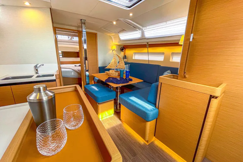 Slide: The Image of Luxurious interior of 2023 Jeanneau Sun Odyssey 440 yacht with modern furnishings. - 18