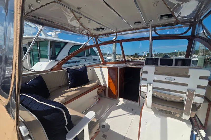 Slide: The Image of Interior of a 1999 Fortier Express 33 boat with seating and navigation equipment. - 17
