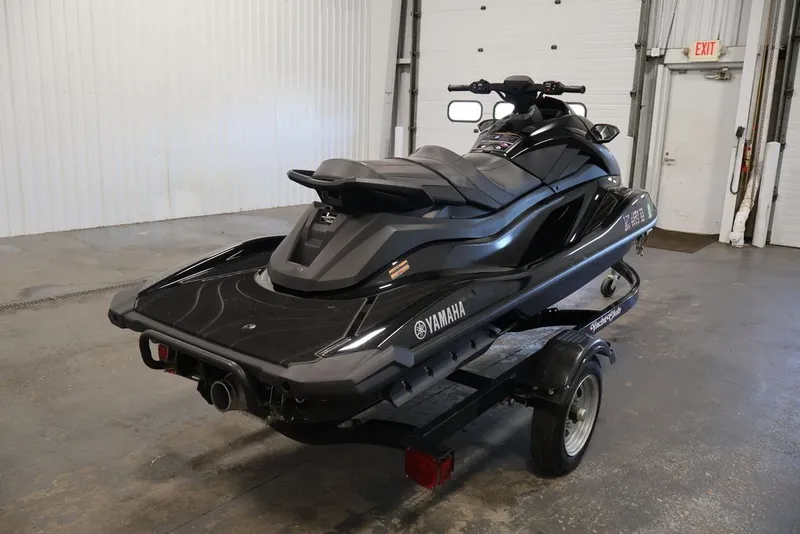 Slide: The Image of 2024 Yamaha WaveRunner GP SVHO jet ski on a trailer in a garage setting. - 6