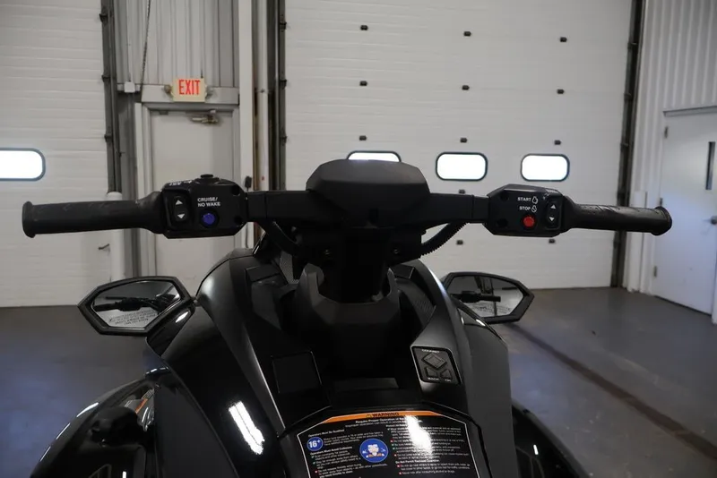 Slide: The Image of 2024 Yamaha WaveRunner GP SVHO handlebars in a garage setting. - 8