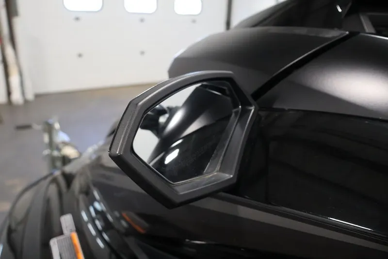 Slide: The Image of 2024 Yamaha WaveRunner GP SVHO side mirror in a garage setting. - 11