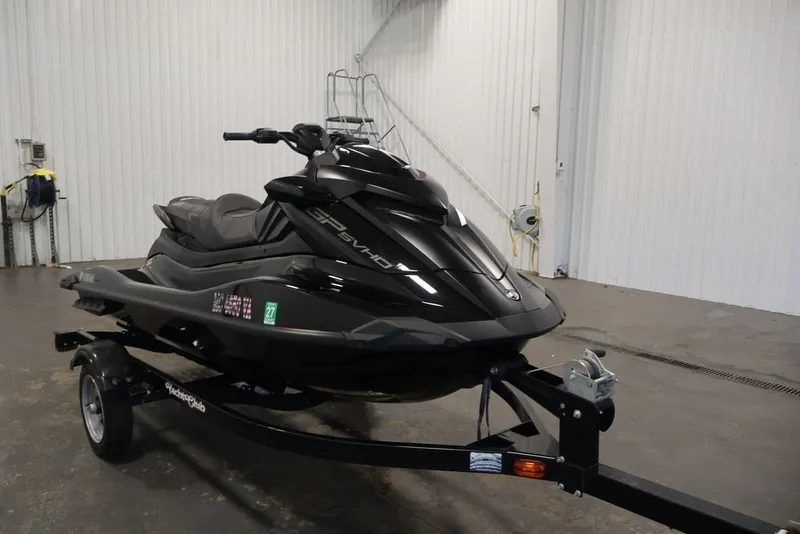 Slide: The Image of 2024 Yamaha WaveRunner GP SVHO jet ski on trailer in garage setting. - 2
