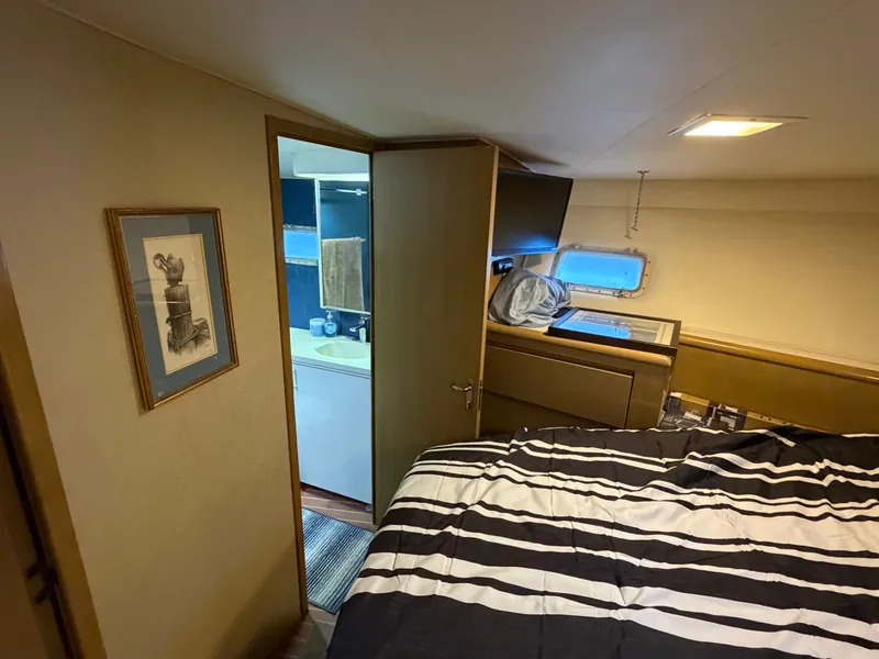Slide: The Image of The image shows a cozy cabin with a bed and an adjoining bathroom. - 45
