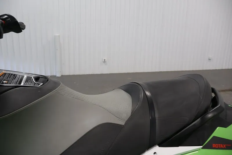 Slide: The Image of 2018 Sea-Doo GTR-X 230 jet ski seat and handlebar detail in a showroom. - 13
