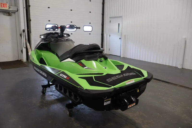 Slide: The Image of 2018 Sea-Doo GTR-X 230 jet ski in a garage setting. - 6