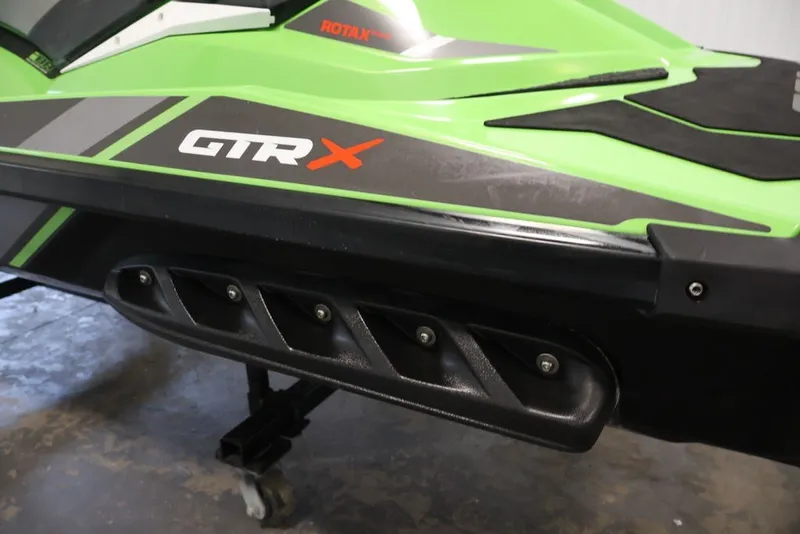 Slide: The Image of 2018 Sea-Doo GTR-X 230, green and black design, close-up view. - 12