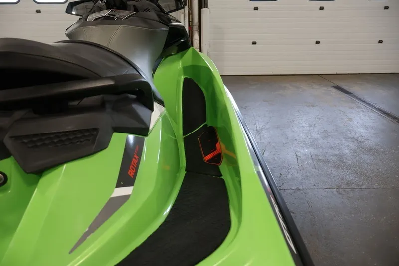 Slide: The Image of 2018 Sea-Doo GTR-X 230 jet ski in vibrant green, showcasing sleek design details. - 14