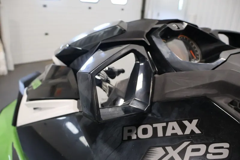 Slide: The Image of 2018 Sea-Doo GTR-X 230 close-up showing Rotax engine branding and side mirror. - 16