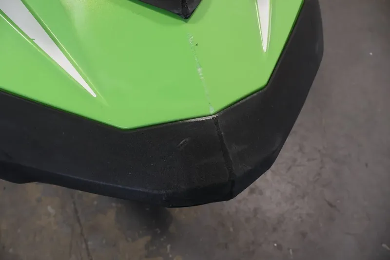 Slide: The Image of Close-up of a 2018 Sea-Doo GTR-X 230 jet ski's green and black hull. - 15