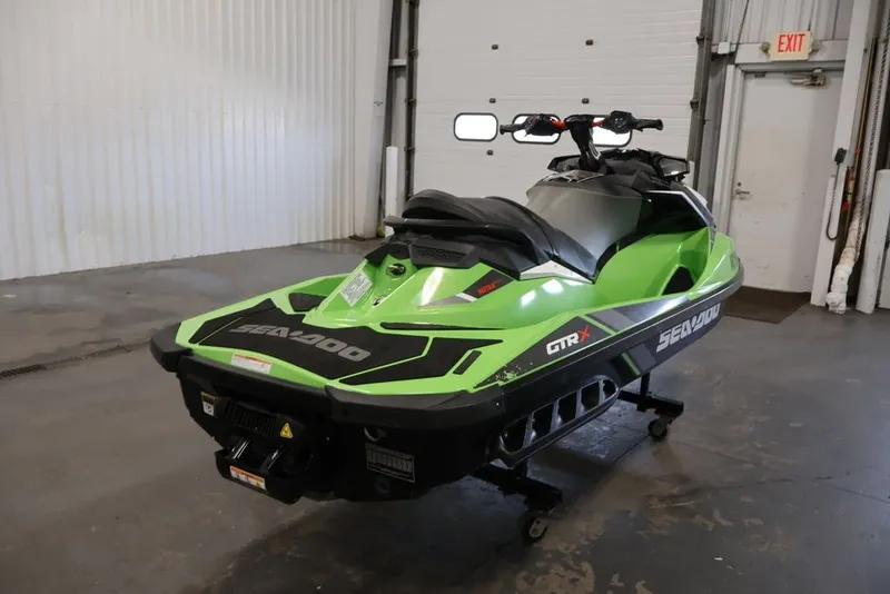Slide: The Image of 2018 Sea-Doo GTR-X 230 jet ski in a garage setting. - 22
