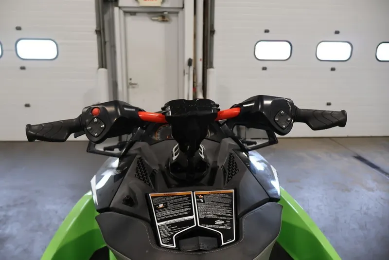 Slide: The Image of 2018 Sea-Doo GTR-X 230 handlebars in a garage setting. - 11