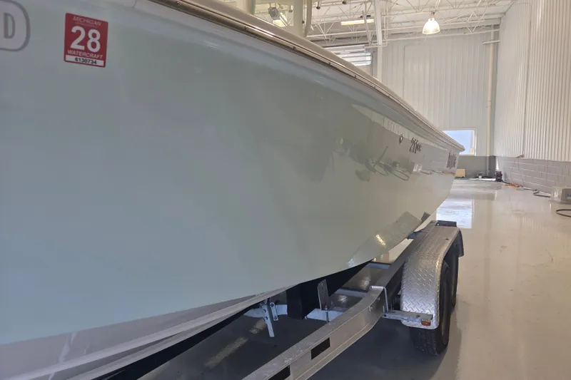 Slide: The Image of 2007 Everglades 211 Center Console boat on trailer in indoor storage facility. - 20