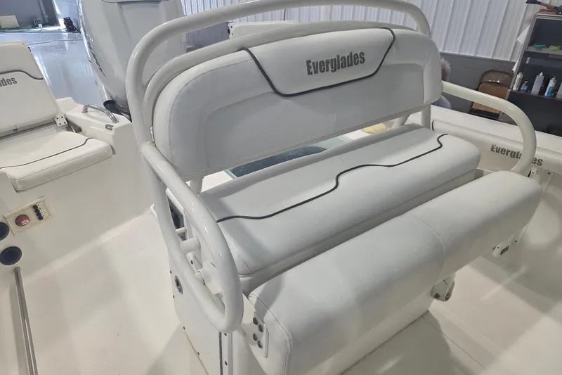 Slide: The Image of 2007 Everglades 211 Center Console boat interior with white cushioned seating. - 5