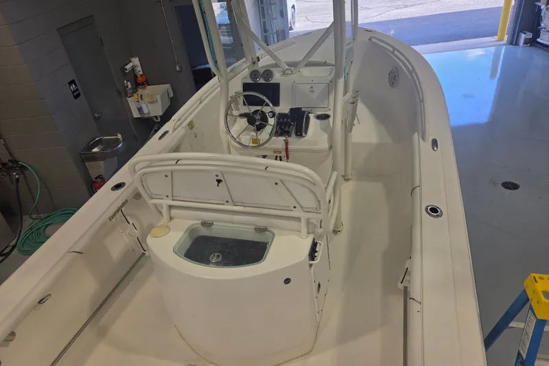 Slide: The Image of 2007 Everglades 211 Center Console boat interior in a garage setting. - 12