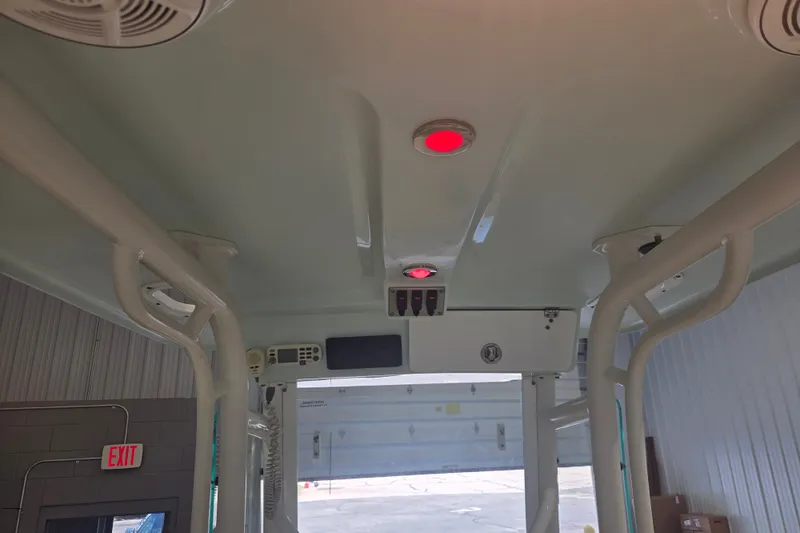 Slide: The Image of Interior view of a 2007 Everglades 211 Center Console boat with red ceiling lights. - 17