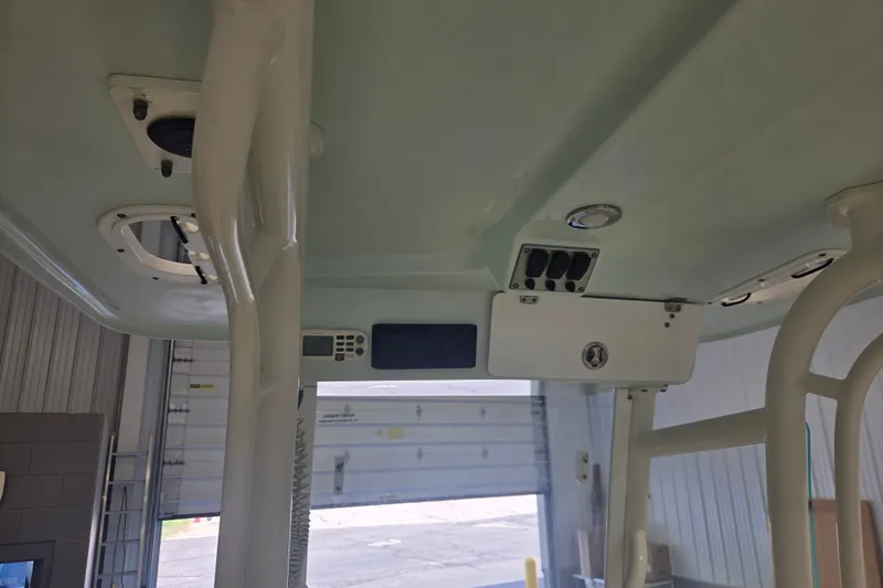 Slide: The Image of Interior view of a 2007 Everglades 211 Center Console boat, showcasing electronics and storage compartments. - 11