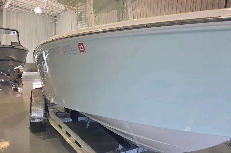 Slide: The Image of 2007 Everglades 211 Center Console boat on trailer in indoor storage facility. - 24