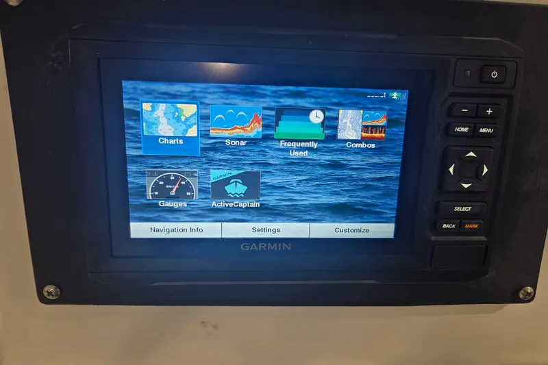 Slide: The Image of Garmin marine display on 2007 Everglades 211 Center Console, showing navigation and sonar options. - 16