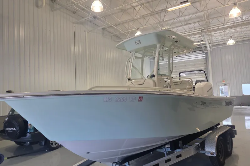 Slide: The Image of 2007 Everglades 211 Center Console boat on trailer in indoor storage facility. - 1