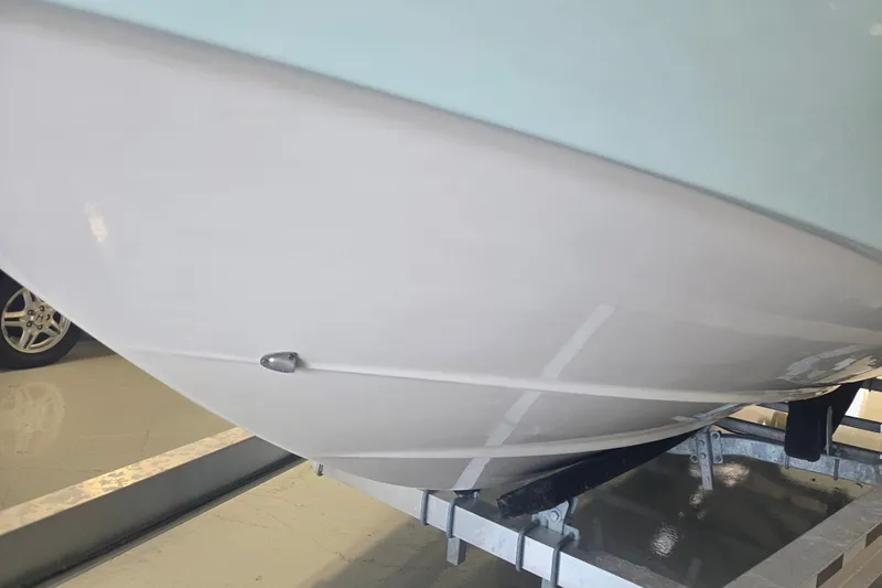 Slide: The Image of 2007 Everglades 211 Center Console boat hull on trailer in garage. - 25