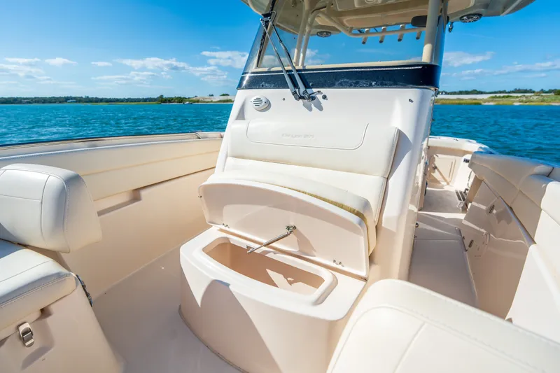 Slide: The Image of 2023 Grady-White Canyon 271 FS boat interior with open storage, on a sunny day. - 11
