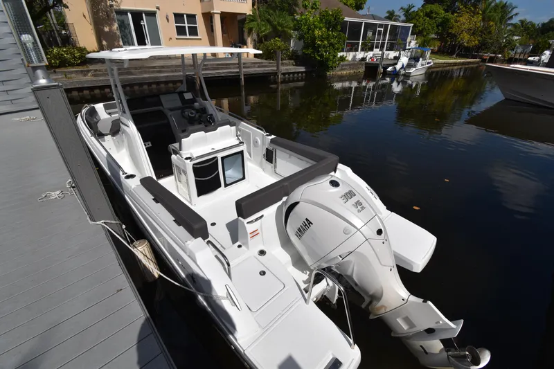 Slide: The Image of 2022 Jeanneau 7.5 Leader boat docked with Yamaha outboard motor. - 6