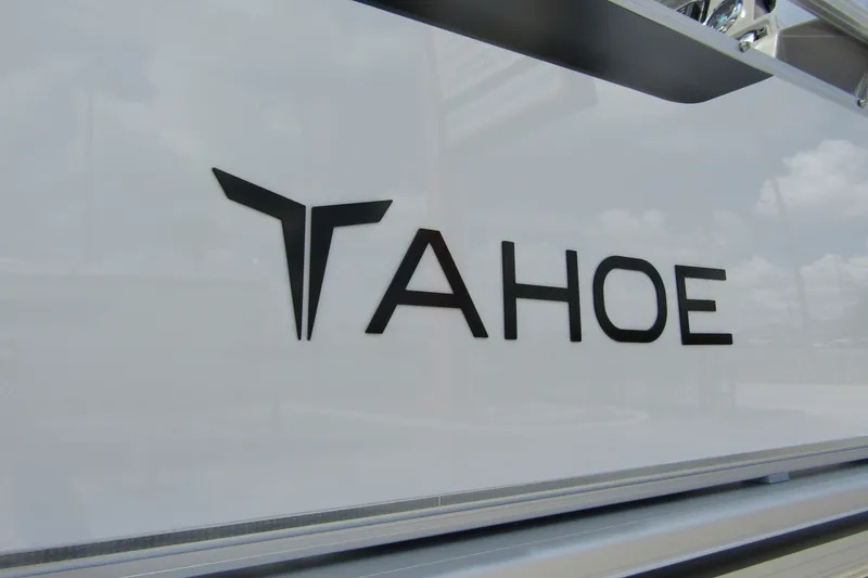 Slide: The Image of 2026 Tahoe Pontoon Sport 85 Versatile Rear Bench logo on boat exterior. - 7