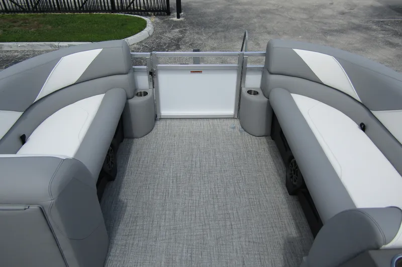 Slide: The Image of 2026 Tahoe Pontoon Sport 85 Versatile Rear Bench interior with gray seating and flooring. - 10