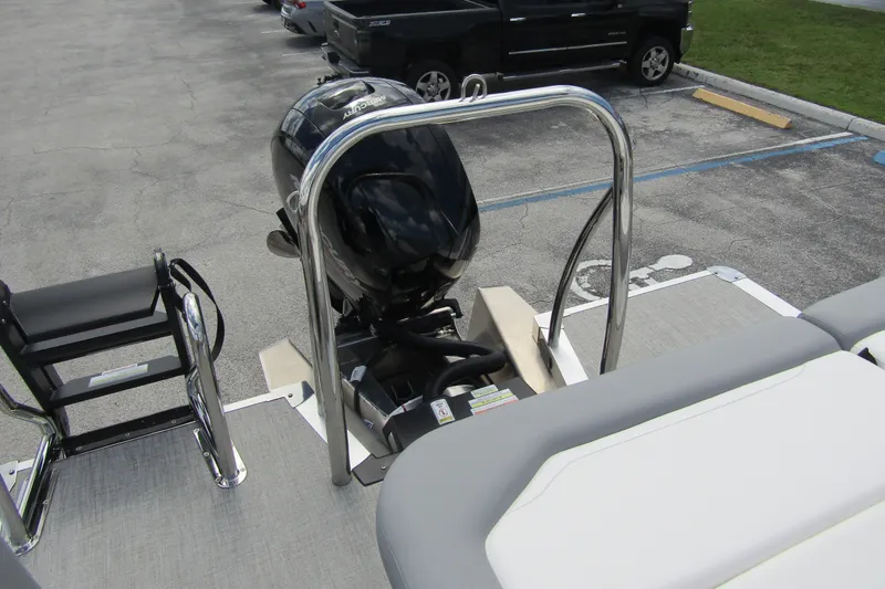 Slide: The Image of 2026 Tahoe Pontoon Sport 85 Versatile Rear Bench with Mercury outboard motor. - 31