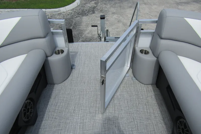 Slide: The Image of 2026 Tahoe Pontoon Sport 85 Versatile Rear Bench interior with gray seating and cup holders. - 9