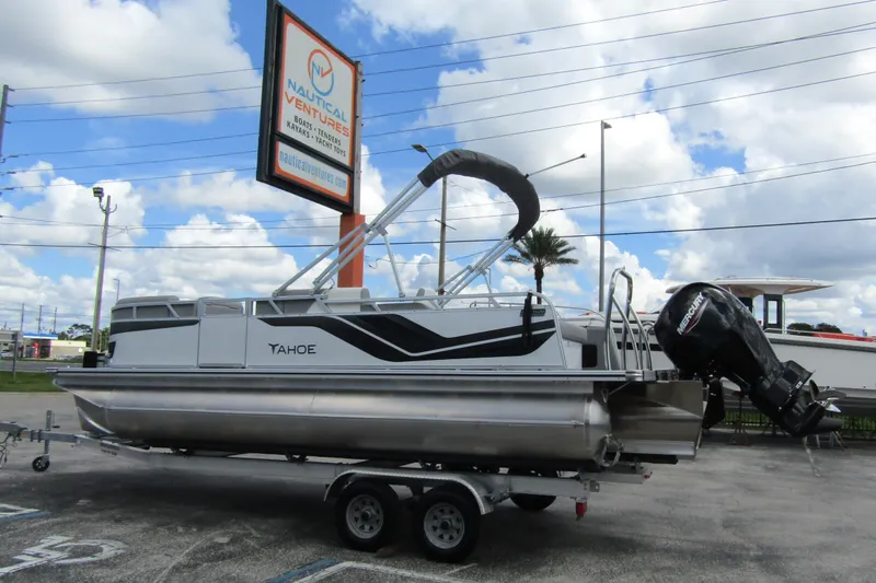Slide: The Image of 2026 Tahoe Pontoon Sport 85 Versatile Rear Bench on trailer, displayed at Nautical Ventures. - 1