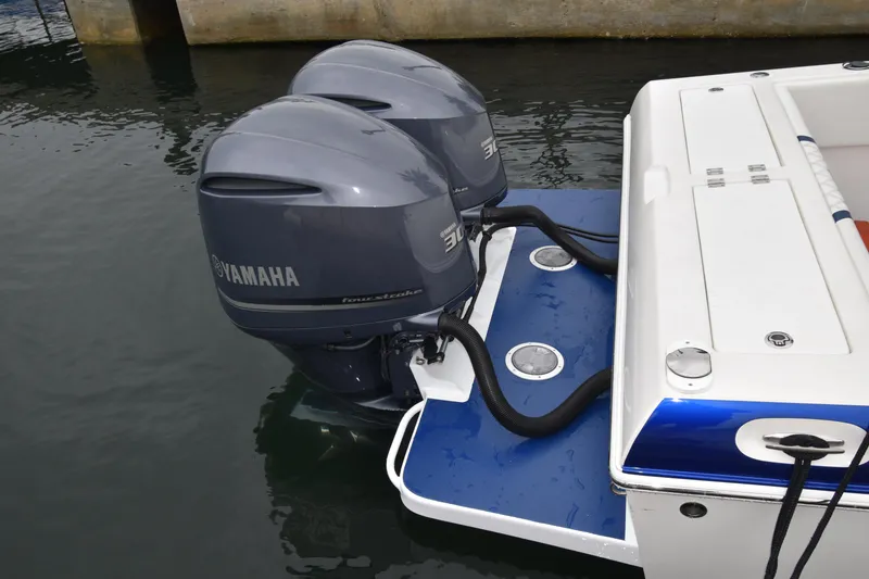 Slide: The Image of 1984 Chris-Craft Scorpion with dual Yamaha outboard motors on water. - 13