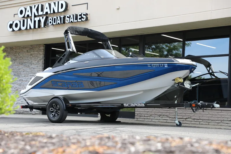 The Image of 2023 Scarab 195 ID boat displayed at Oakland County Boat Sales dealership. - 1