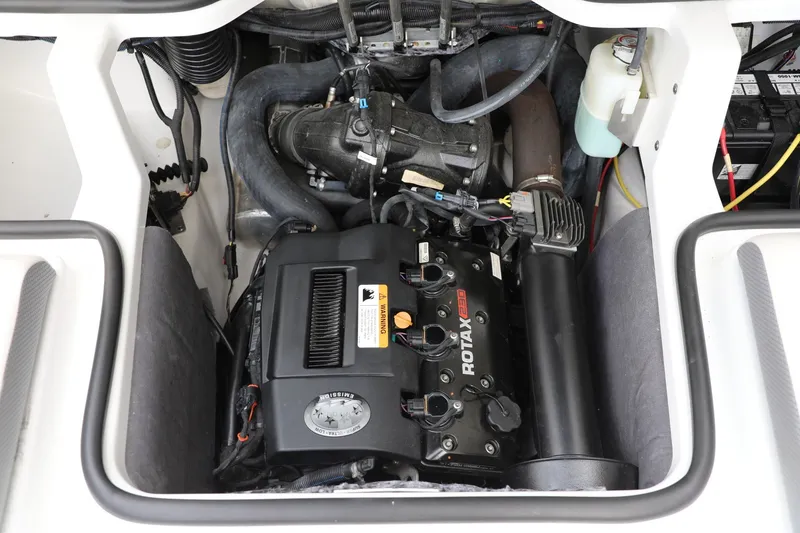Slide: The Image of Engine compartment of 2023 Scarab 195 ID boat featuring a Rotax 230 engine. - 10
