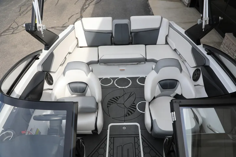 Slide: The Image of Interior of 2023 Scarab 195 ID boat with modern seating and sleek design. - 12