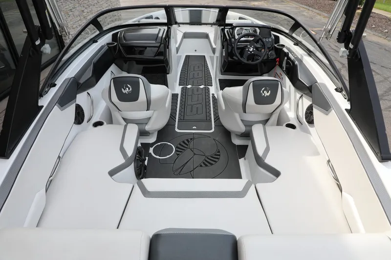 Slide: The Image of 2023 Scarab 195 ID boat interior with modern seating and dashboard design. - 5