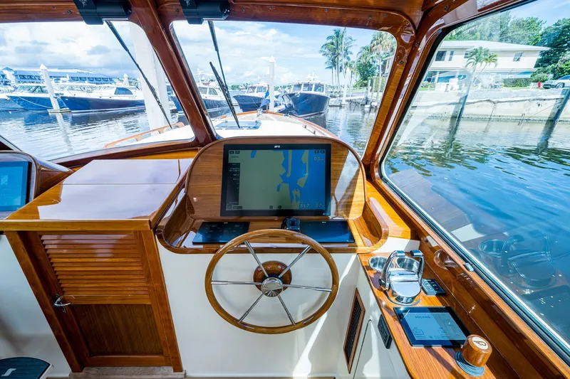 Slide: The Image of Helm of 2009 Hinckley Picnic Boat 37 MKIII with navigation display and wooden finish. - 18