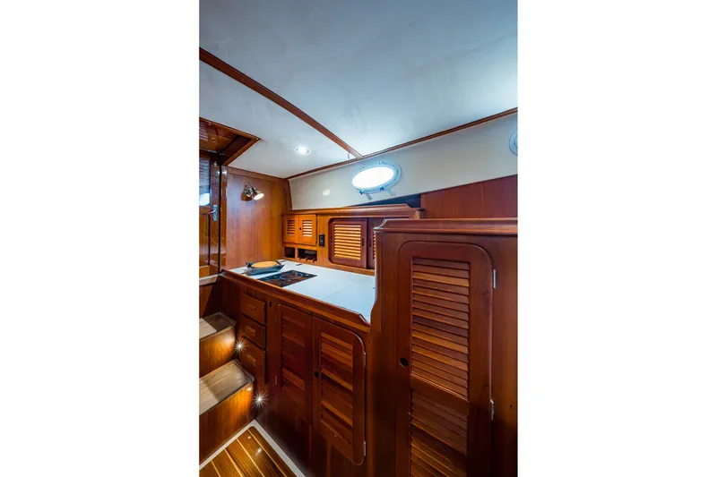 Slide: The Image of Luxurious wooden interior of 2009 Hinckley Picnic Boat 37 MKIII galley area. - 20