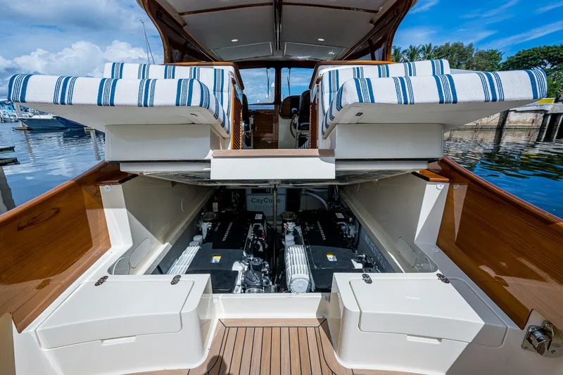 Slide: The Image of Hinckley Picnic Boat 37 MKIII 2009 engine compartment with striped seating, dockside view. - 26